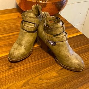 Strapped distressed ankle boots